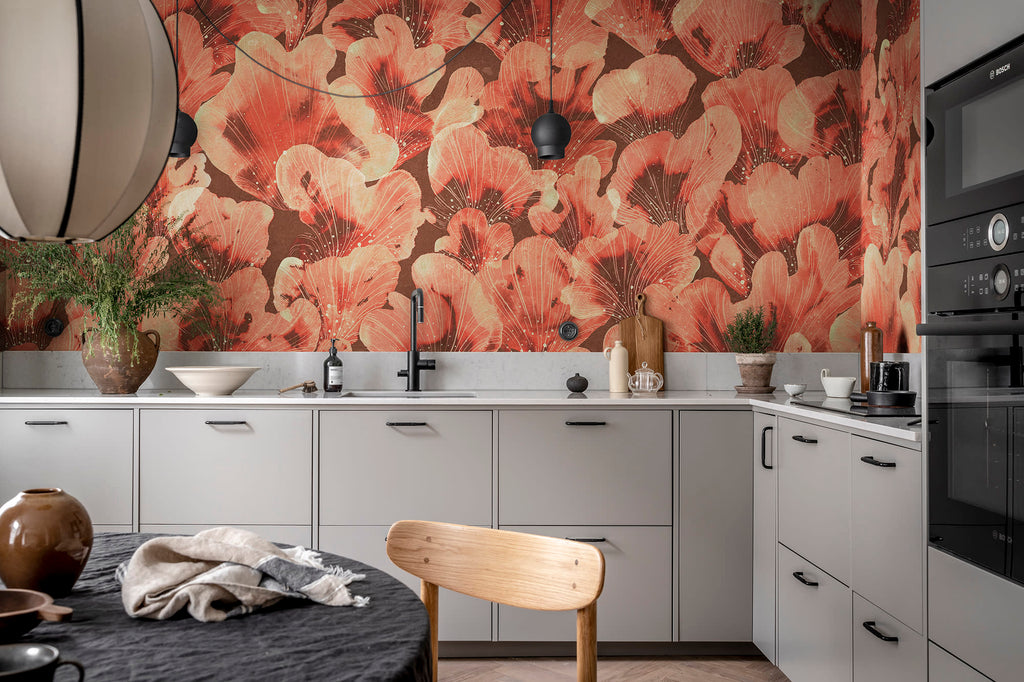 Corals wall mural by Rebel Walls in coral red, as a kitchen splashback above grey cabinets