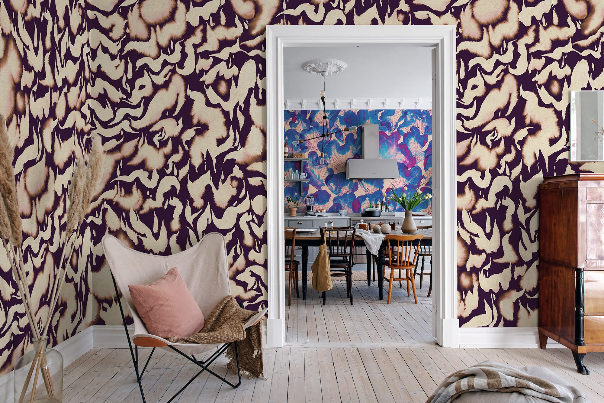 Discus Fish wall mural by Rebel Walls in plum purple and cream swirls, in an entry with butterfly chair by a doorway