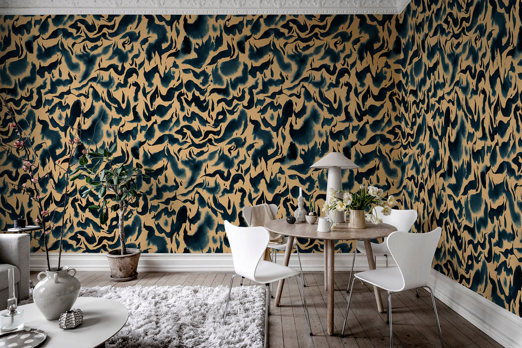 Discus Fish wall mural by Rebel Walls in navy and gold swirls, in a dining room with round table and white chairs
