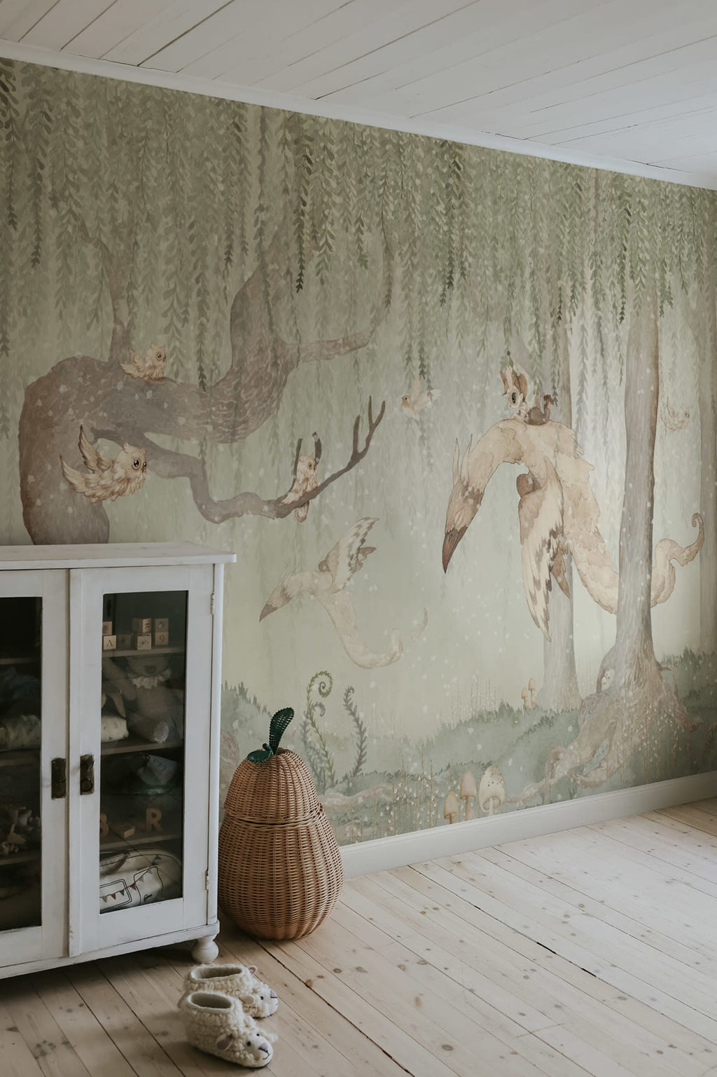 Dream Forest Boy kids wall mural by Rebel Walls in green tones, styled in a nursery