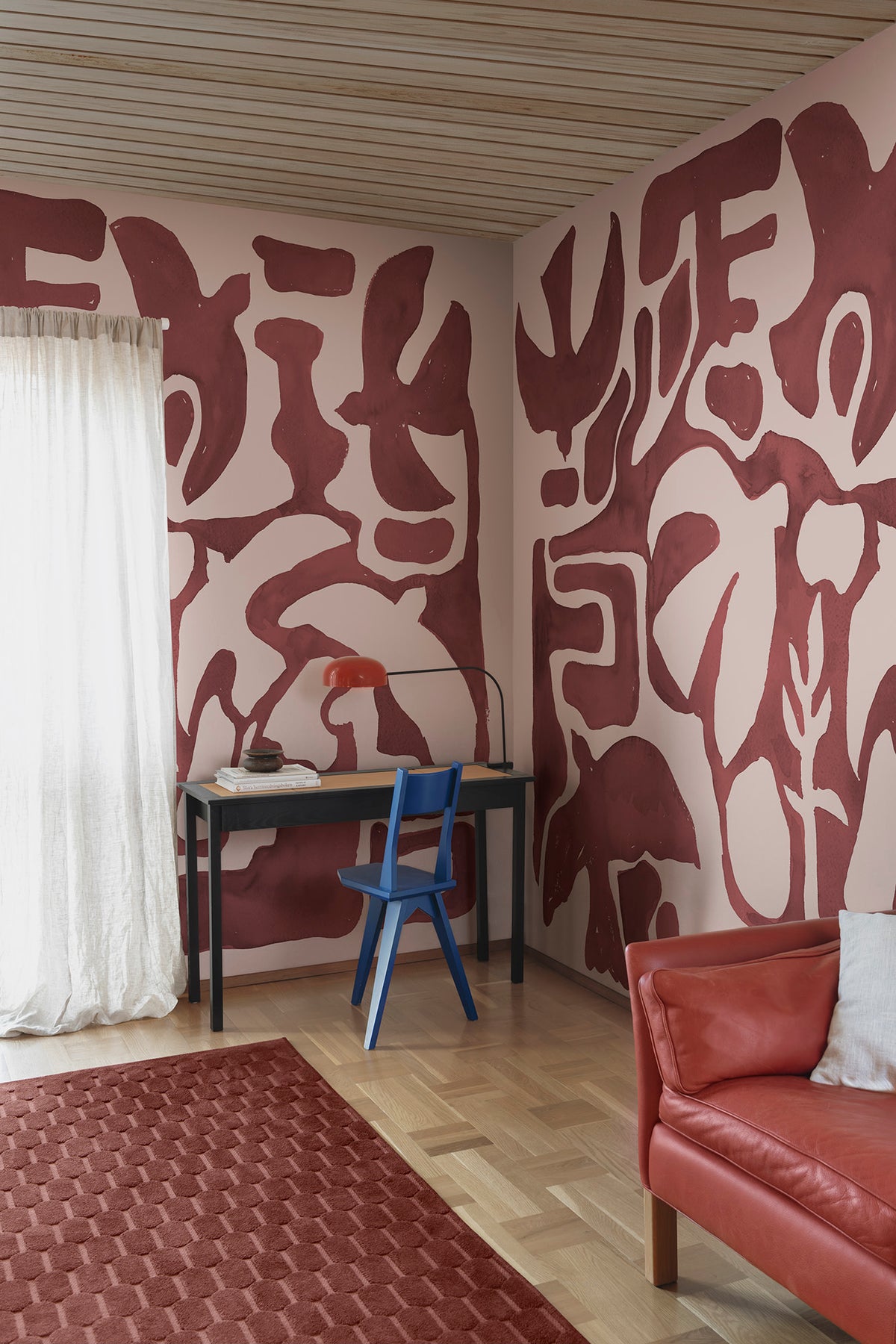 Harmony Forms wall mural by Rebel Walls in Red, styled room