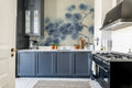 Pine Branch wall mural by Rebel Walls in Blue, styled room