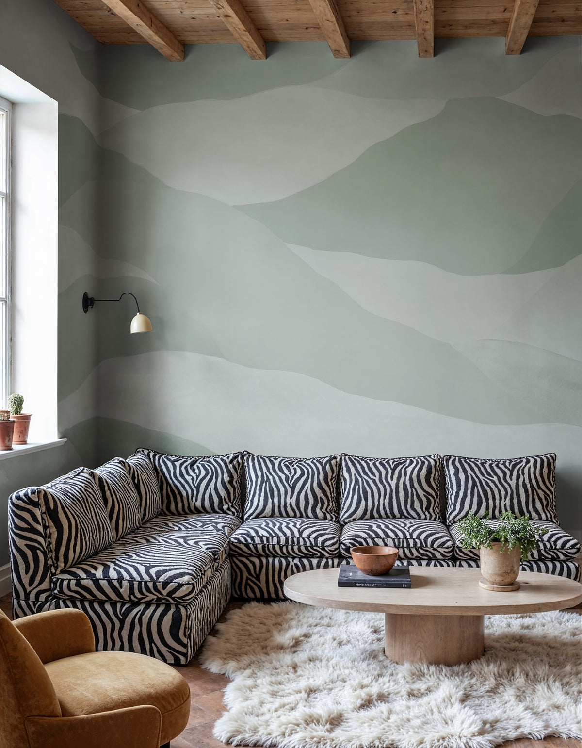 Misty Peaks wall mural by Rebel Walls in Light Green, styled room