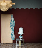 Wave Border wall mural by Rebel Walls in Red – Burgundy, styled room