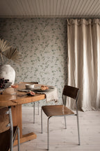 Irene wallpaper by Sandberg in Olive Green, styled on an interior wall