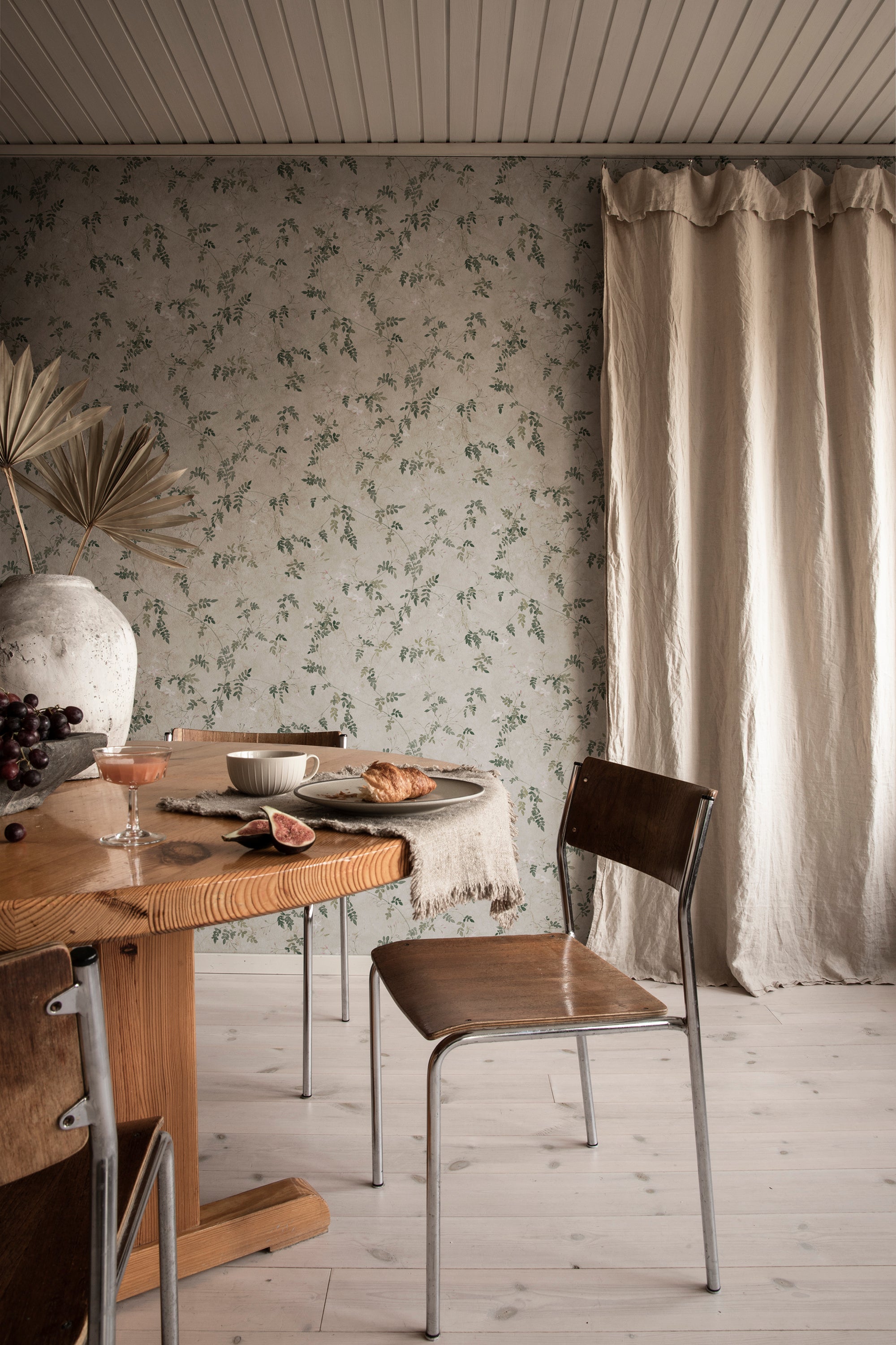 Irene wallpaper by Sandberg in Olive Green, styled on an interior wall