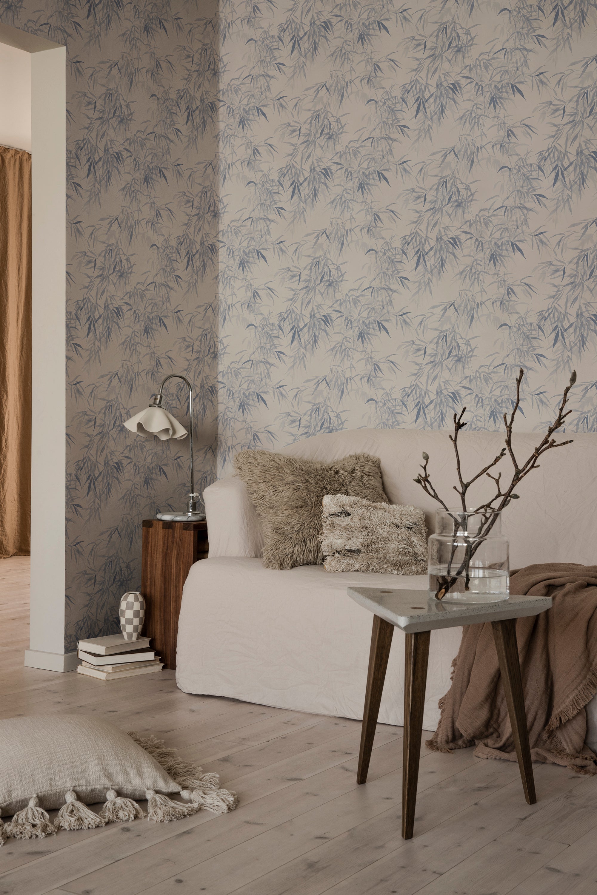 Jon wallpaper by Sandberg in Indigo Blue, styled on an interior wall