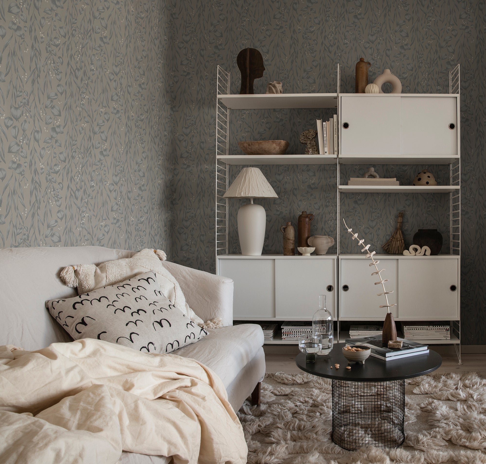 Sara wallpaper by Sandberg in Misty Blue, styled on an interior wall