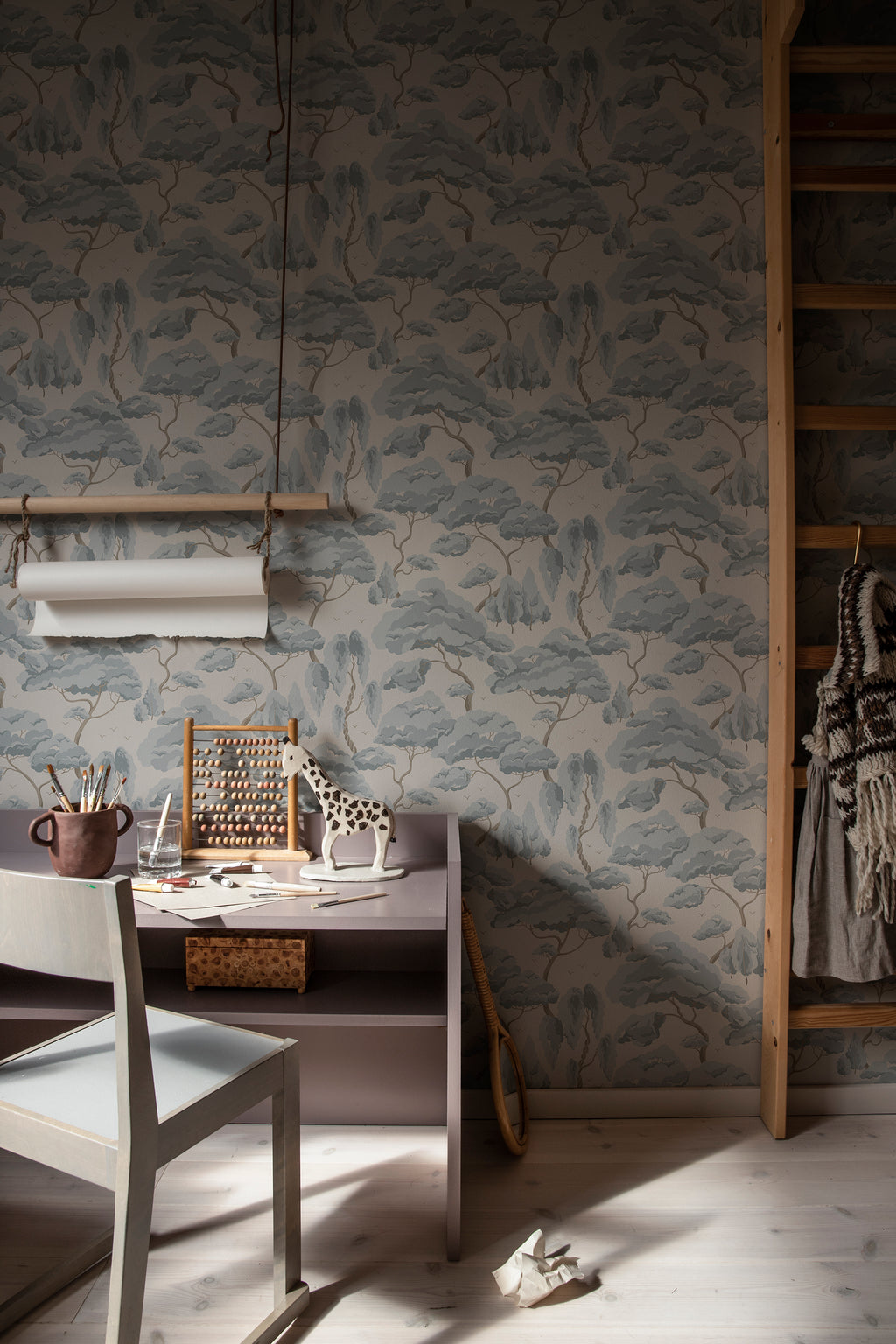 Kristoffer wallpaper by Sandberg in Misty Blue, styled on an interior wall