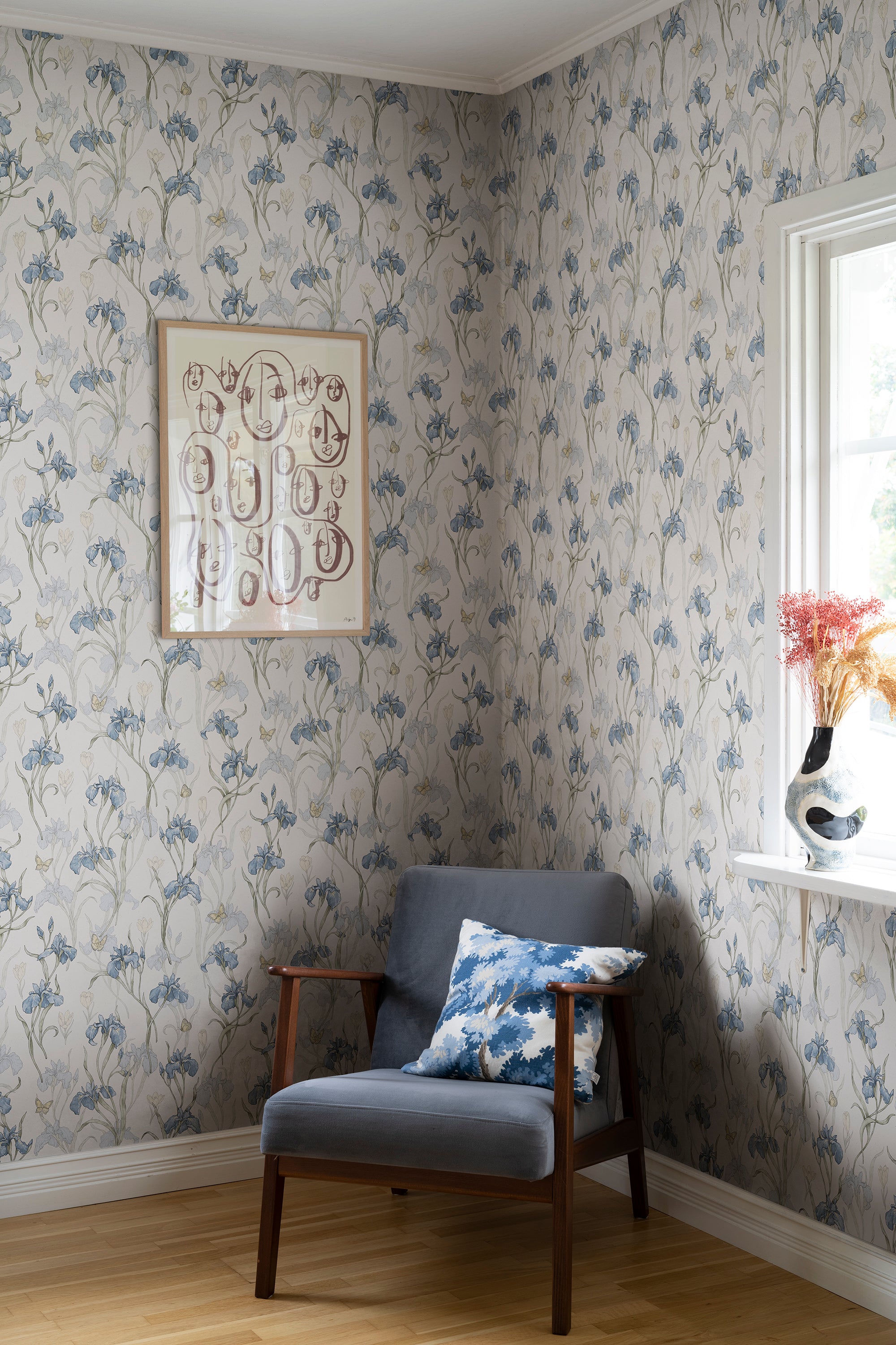 Iris wallpaper by Sandberg in Sky Blue, styled on an interior wall