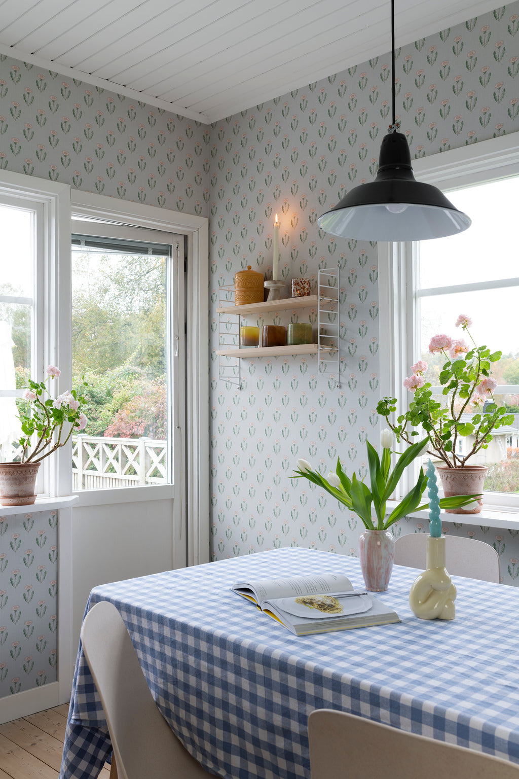 Maskrosen wallpaper by Sandberg in Soft Blue, styled on an interior wall
