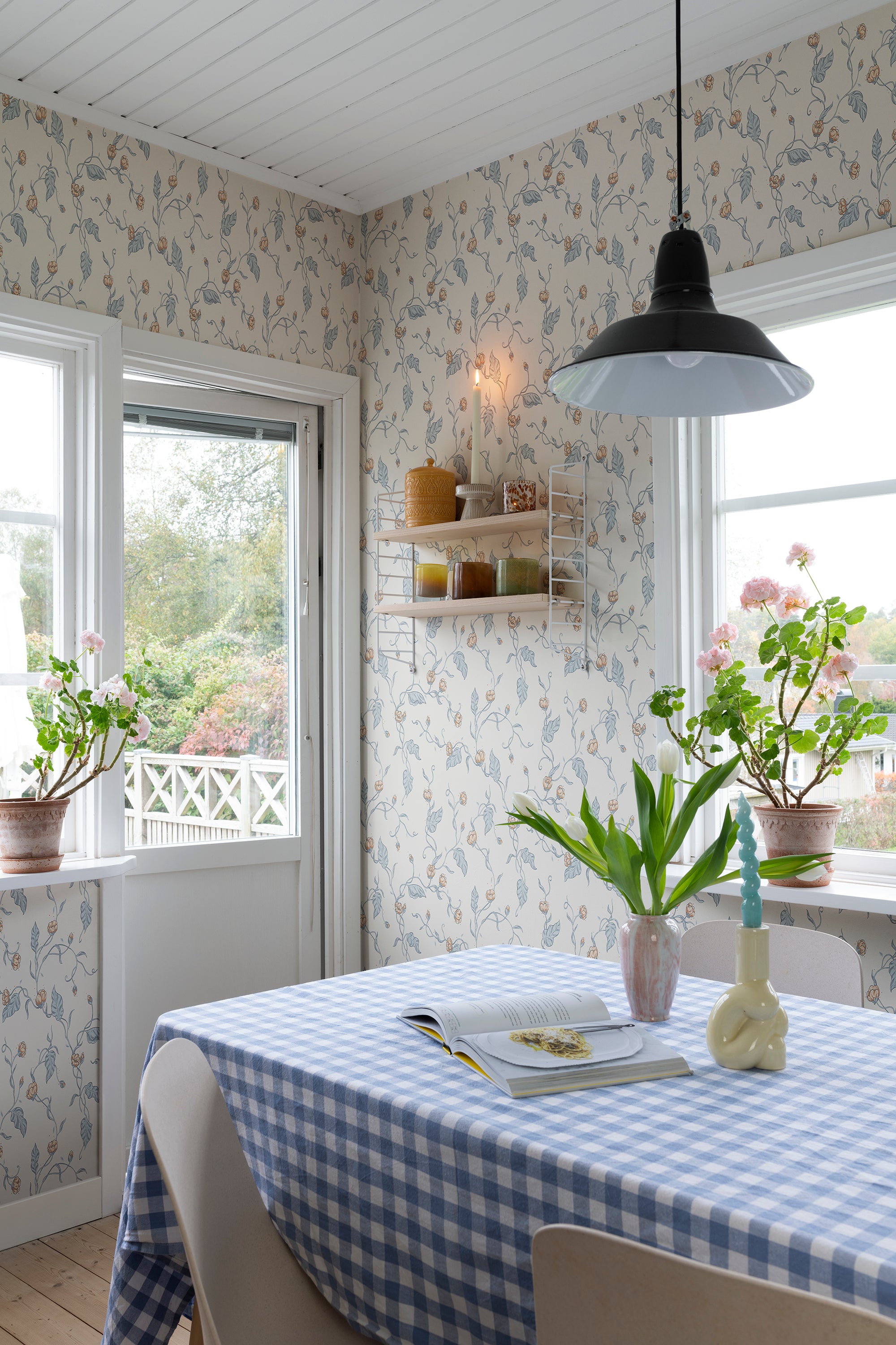 Elmire wallpaper by Sandberg in Soft Blue, styled on an interior wall