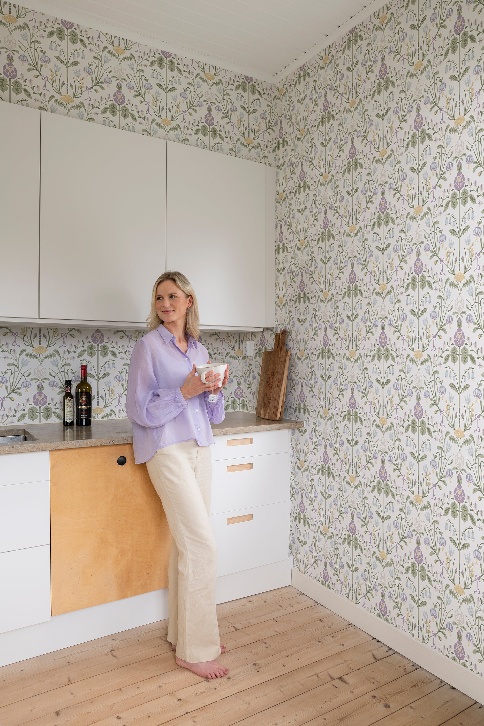 Till Carl wallpaper by Sandberg in Lilac, styled on an interior wall