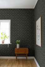 Signe wallpaper by Sandberg in dark green styled in a corner with a teak console, white tulips and a framed line-drawing portrait