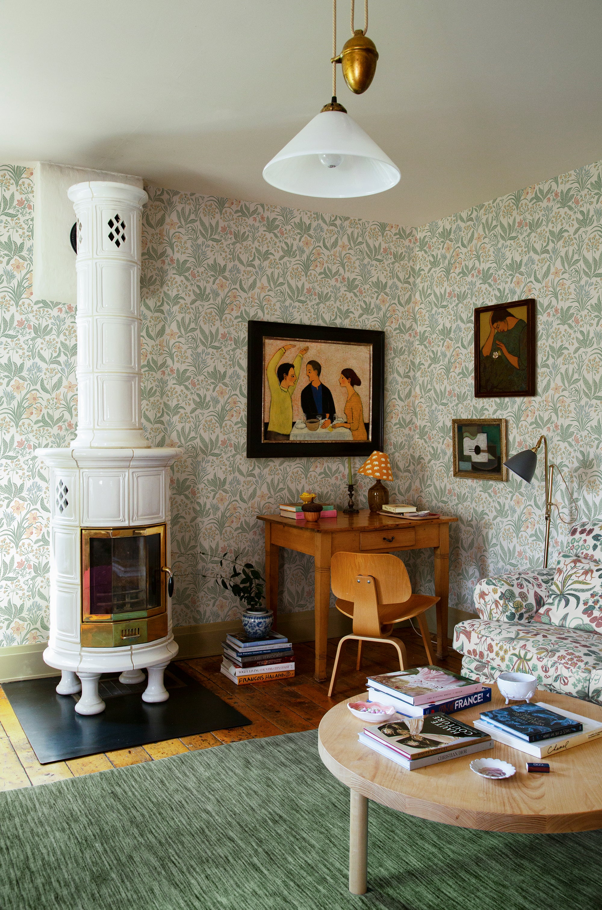 Huset i Solen wallpaper by Sandberg in Spring Green, styled on an interior wall
