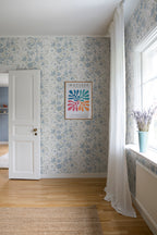 Karins Bukett wallpaper by Sandberg in Sky Blue, styled on an interior wall