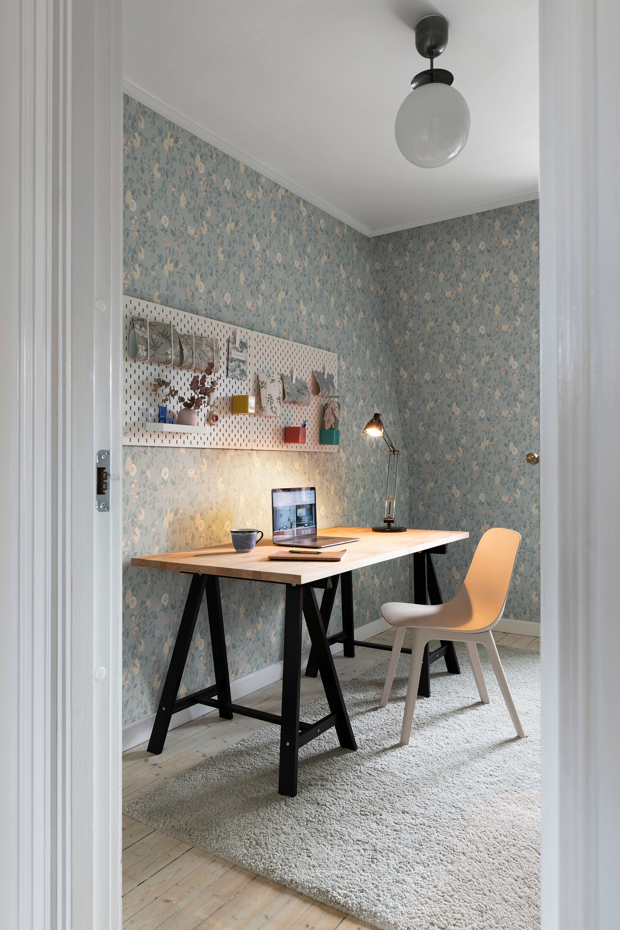 Kvitten wallpaper by Sandberg in Soft Blue, styled on an interior wall