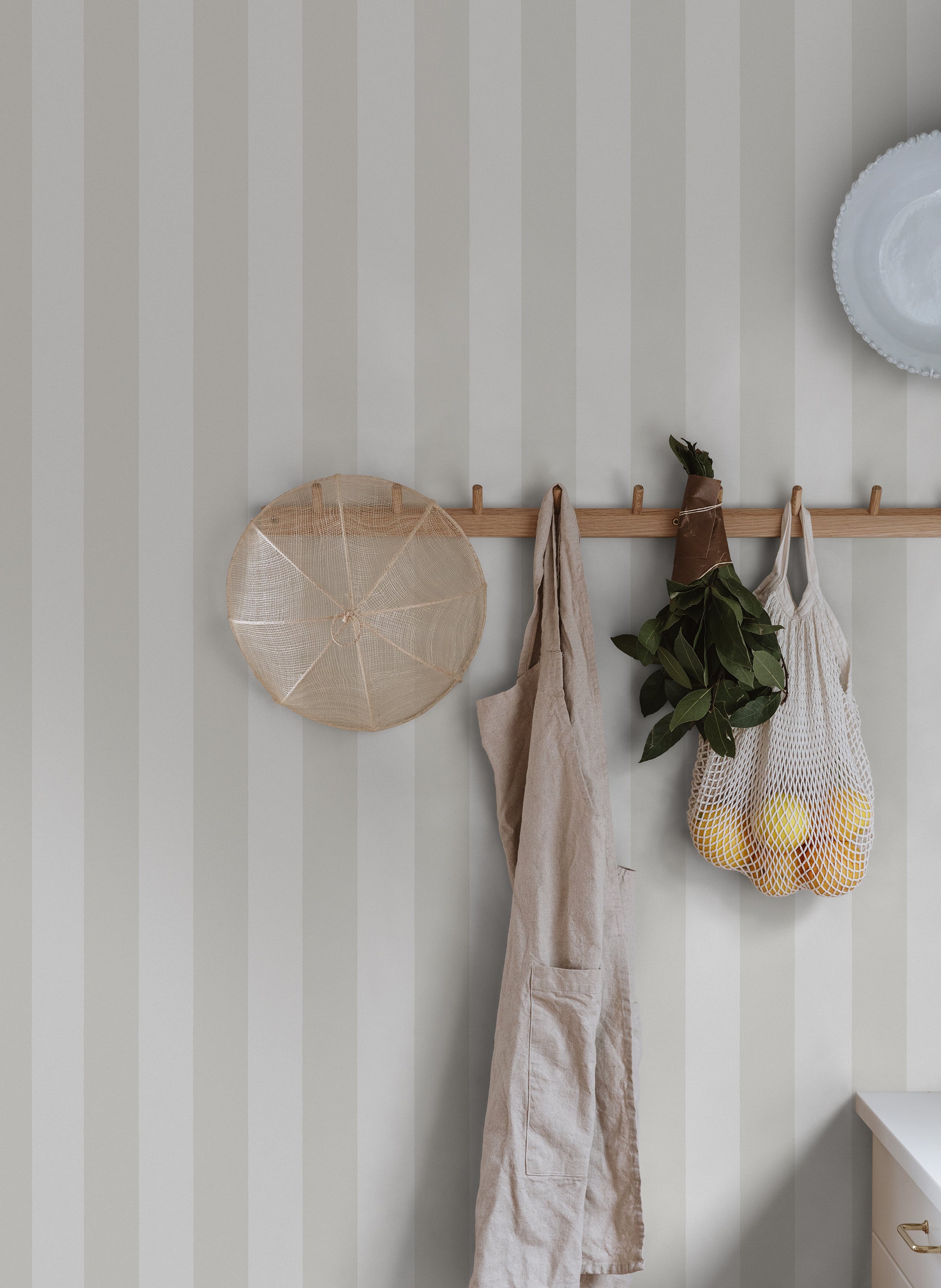 Sam wallpaper by Sandberg in Sandstone, styled on an interior wall
