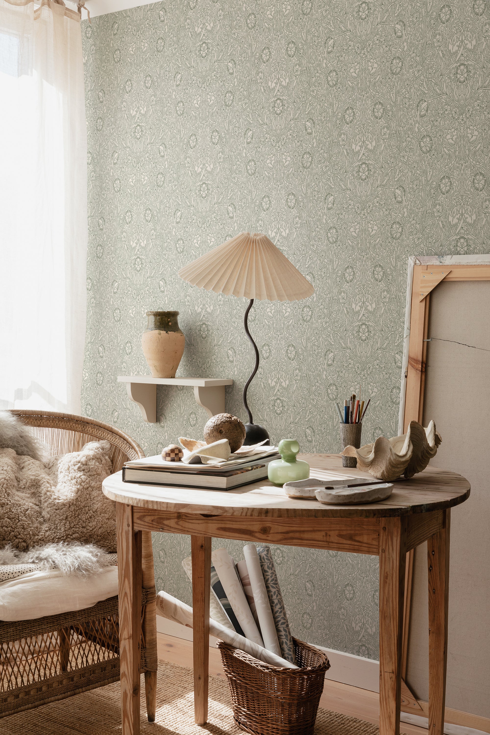 Caroline wallpaper by Sandberg in Moss Green, styled on an interior wall