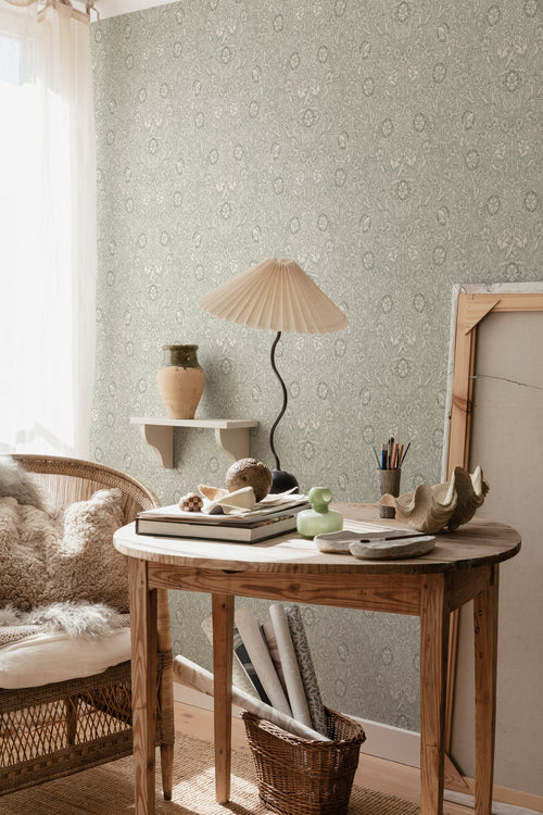 Caroline wallpaper by Sandberg in Moss Green, styled on an interior wall