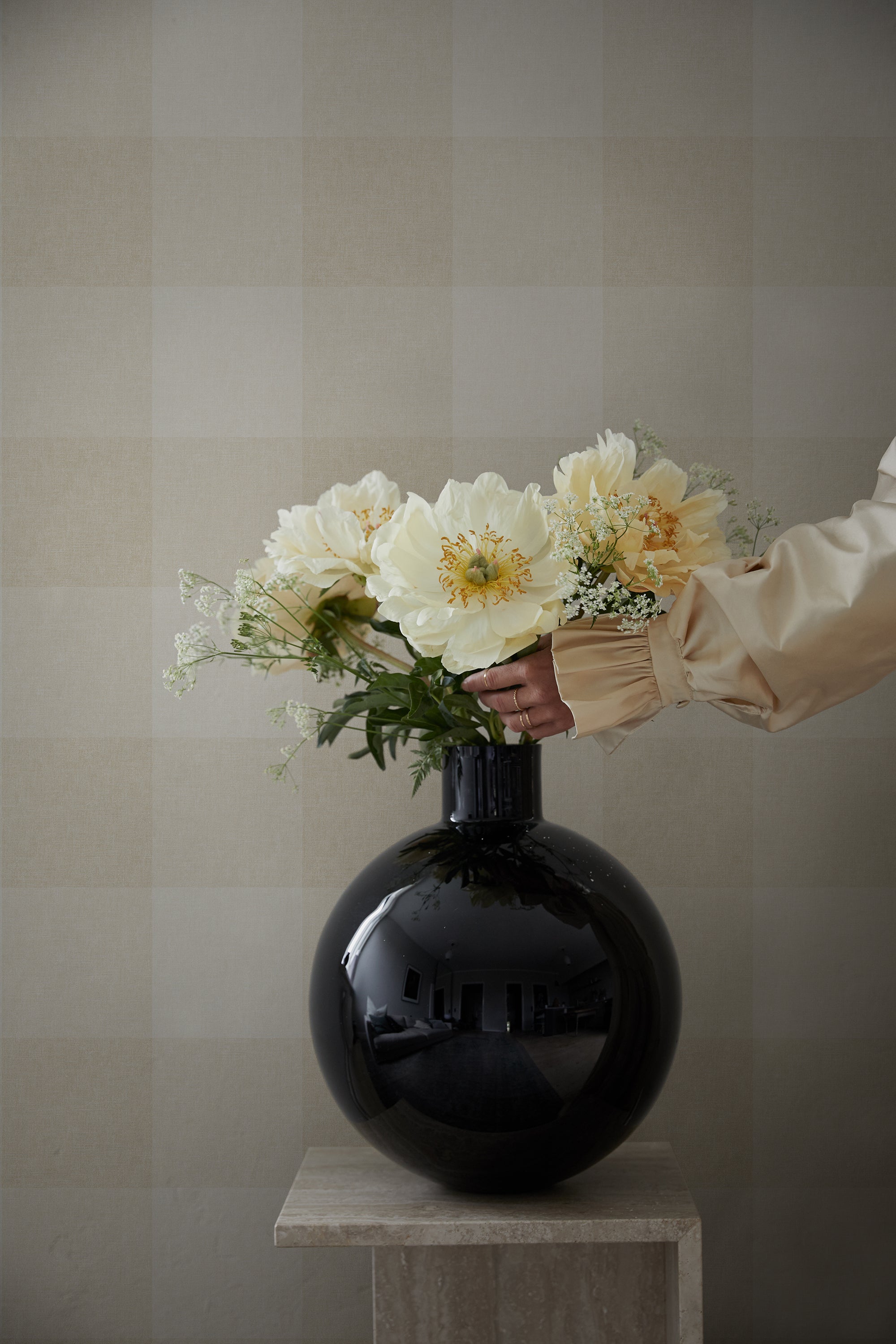 Lykke wallpaper by Sandberg in Oat, styled on an interior wall