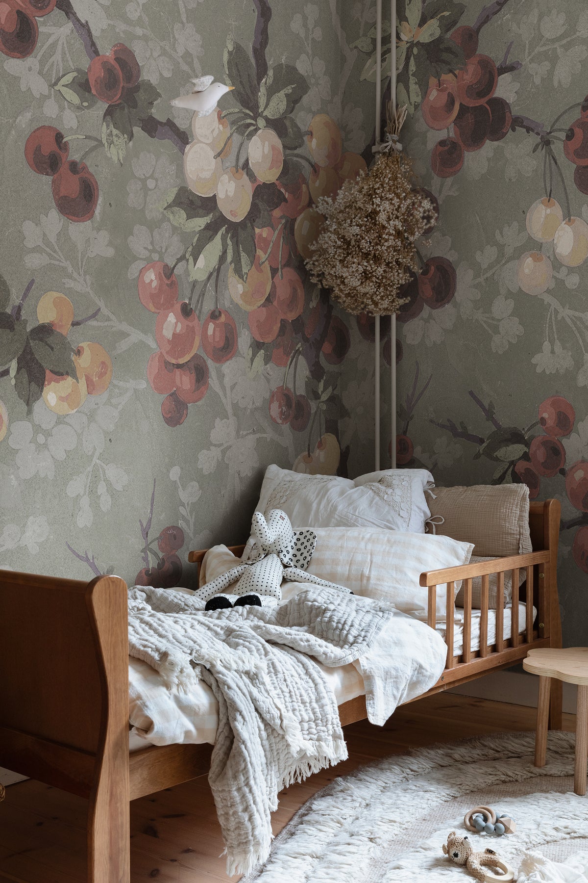 Franka wall mural by Sandberg in Sage Green, styled on an interior wall