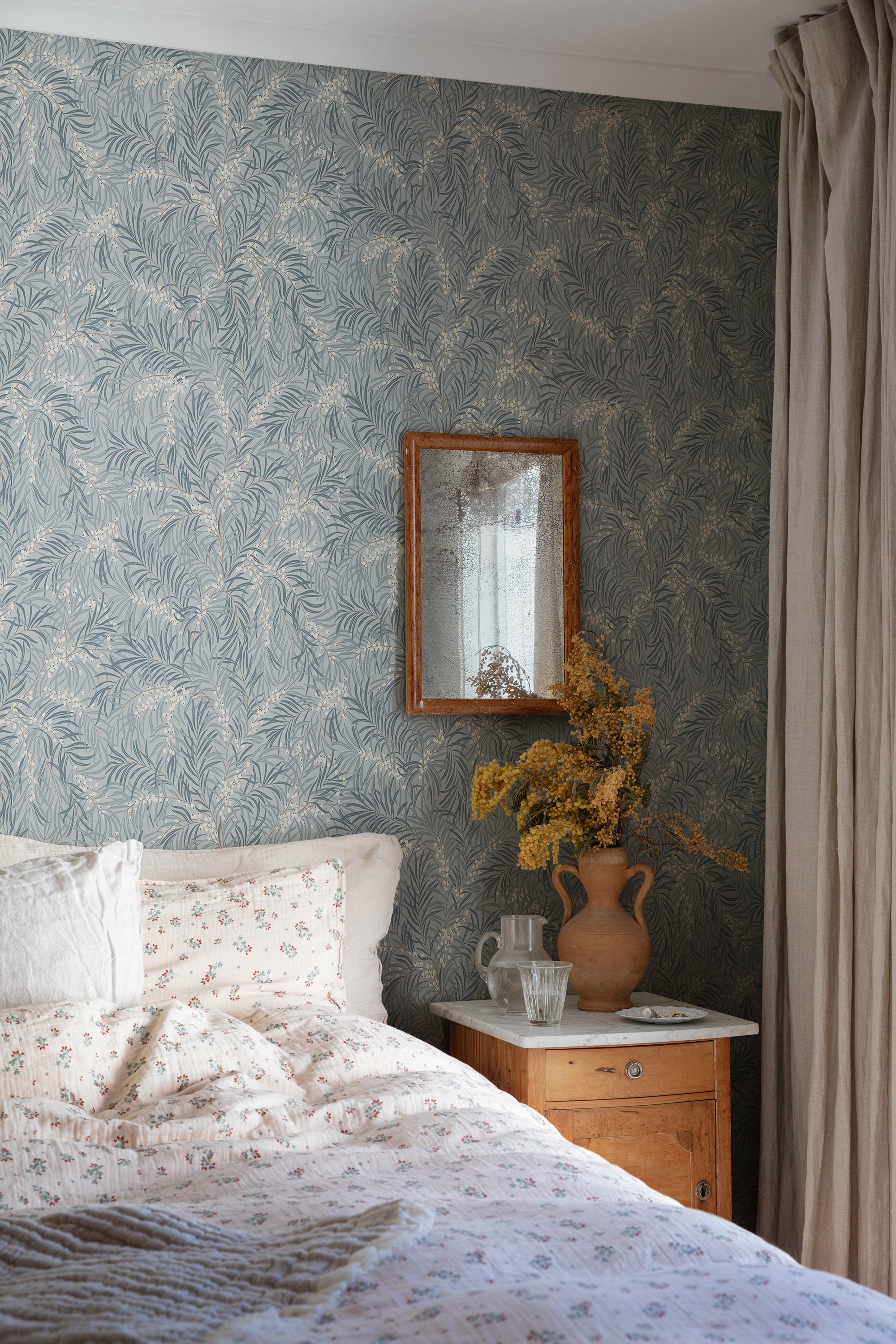 Idun wallpaper by Sandberg in Misty Blue, styled on an interior wall