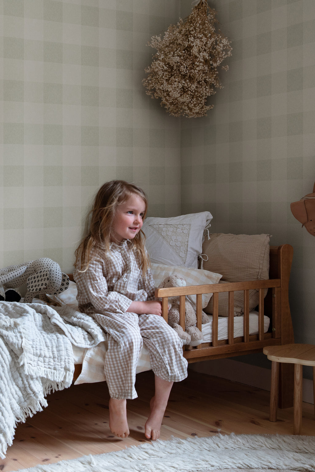 Lykke wallpaper by Sandberg in Spring Green, styled on an interior wall