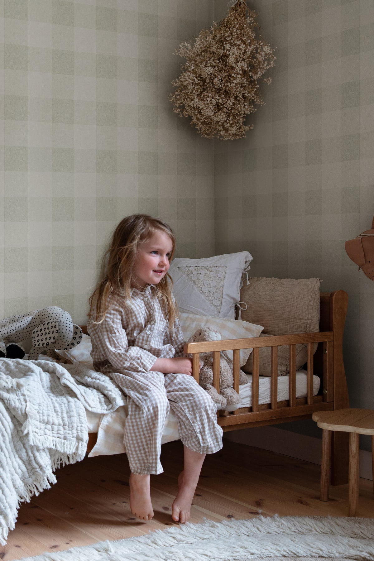 Lykke wallpaper by Sandberg in Spring Green, styled on an interior wall