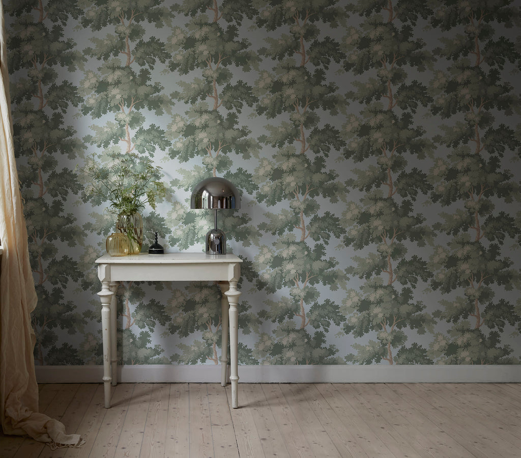 Raphael wallpaper by Sandberg in Green - botanical design, above a small white table