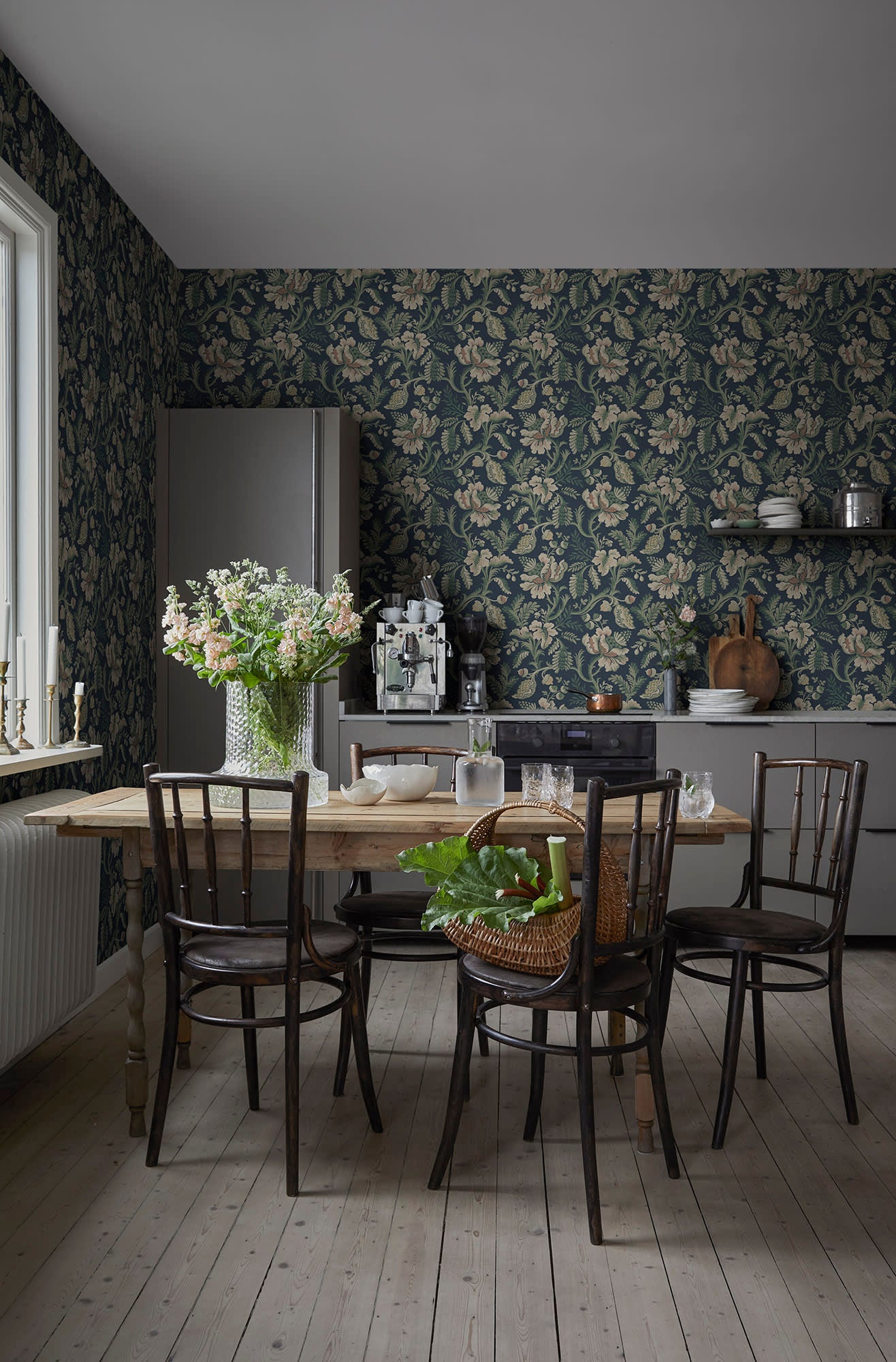 Daphne wallpaper by Sandberg in navy in a dining room with bentwood chairs and a pine table
