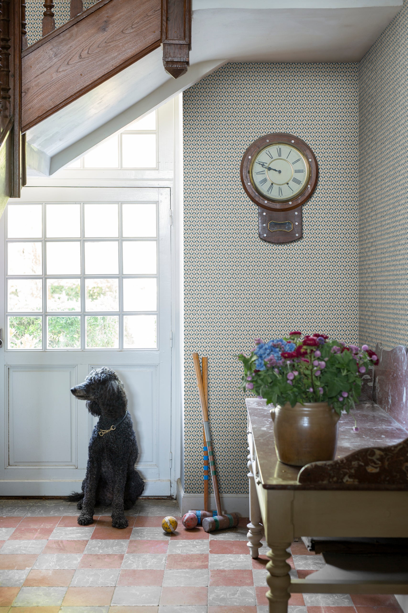 Hugo wallpaper by Sandberg in Terracotta, styled on an interior wall