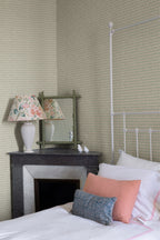 Hugo wallpaper by Sandberg in Oat, styled on an interior wall