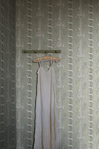 Alexandra wallpaper by Sandberg in Sage Green, styled on an interior wall