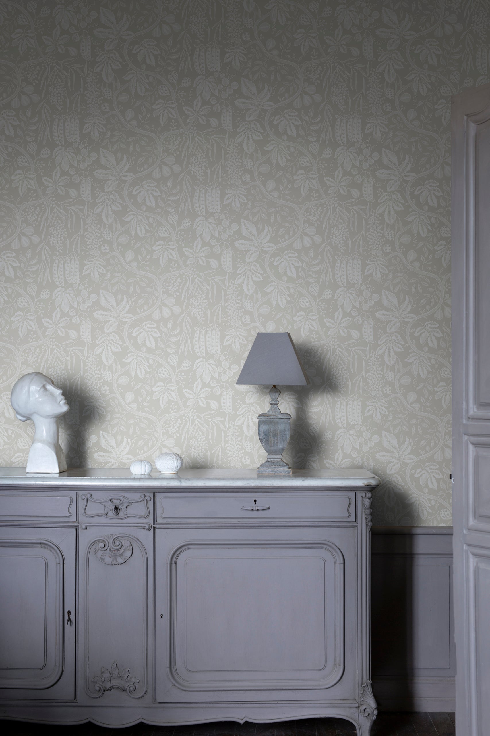 Fig Garden wallpaper by Sandberg in Sandstone, styled on an interior wall