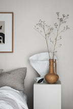 Valv wallpaper by Sandberg in Grey, styled on an interior wall