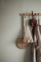 Valv wallpaper by Sandberg in Sage Green, styled on an interior wall