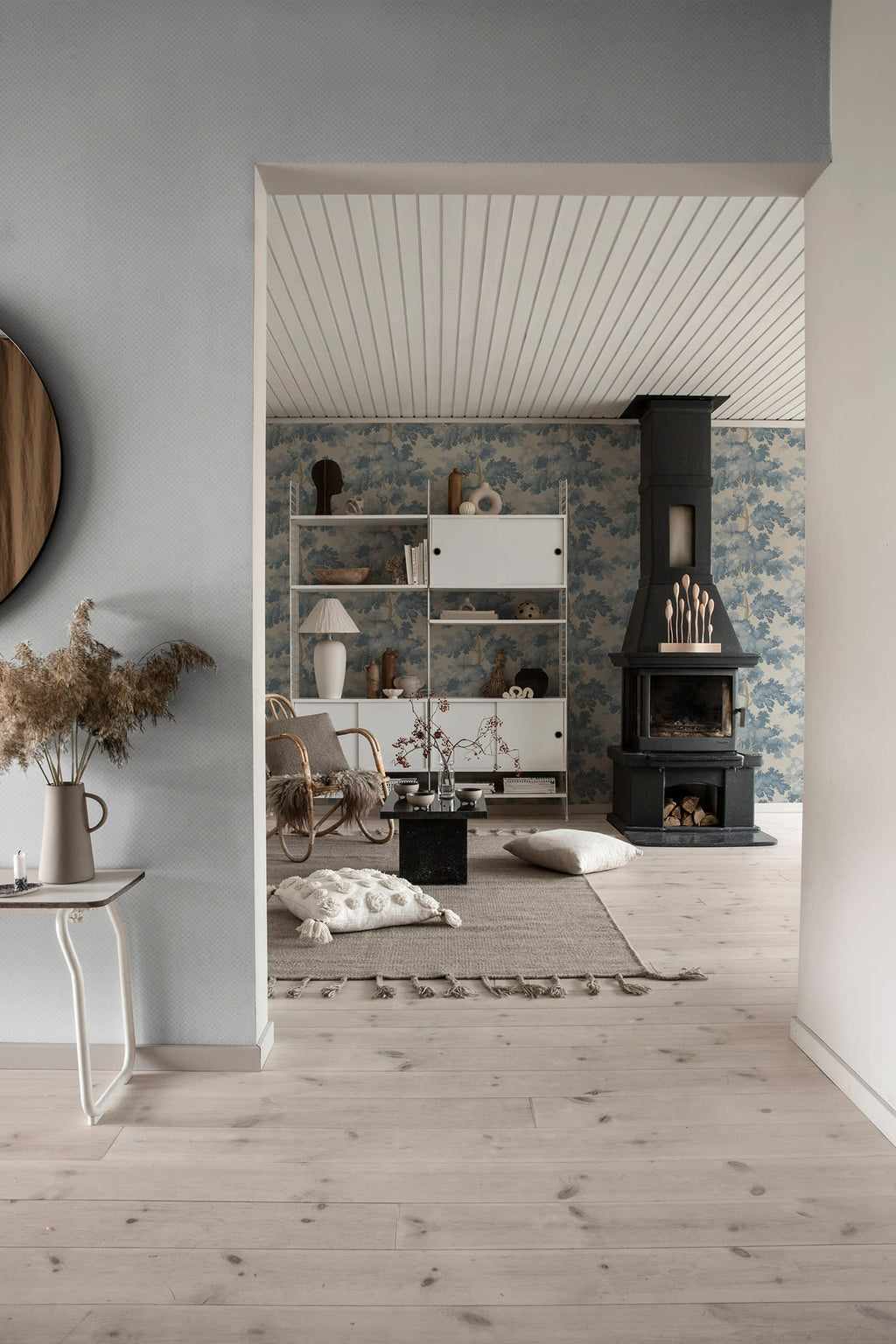 Valv wallpaper by Sandberg in Misty Blue, styled on an interior wall