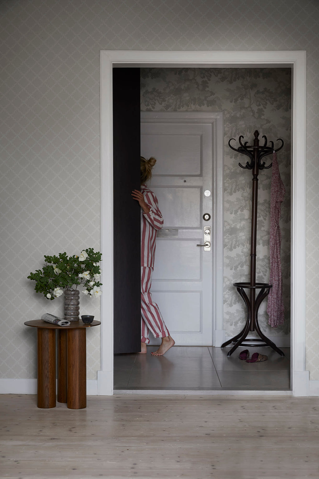 Trellis wallpaper by Sandberg in Grey, styled on an interior wall