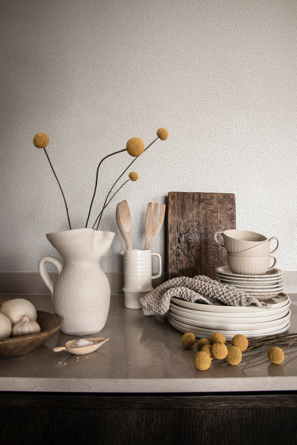 Bladverk wallpaper by Sandberg in Grey, styled on an interior wall