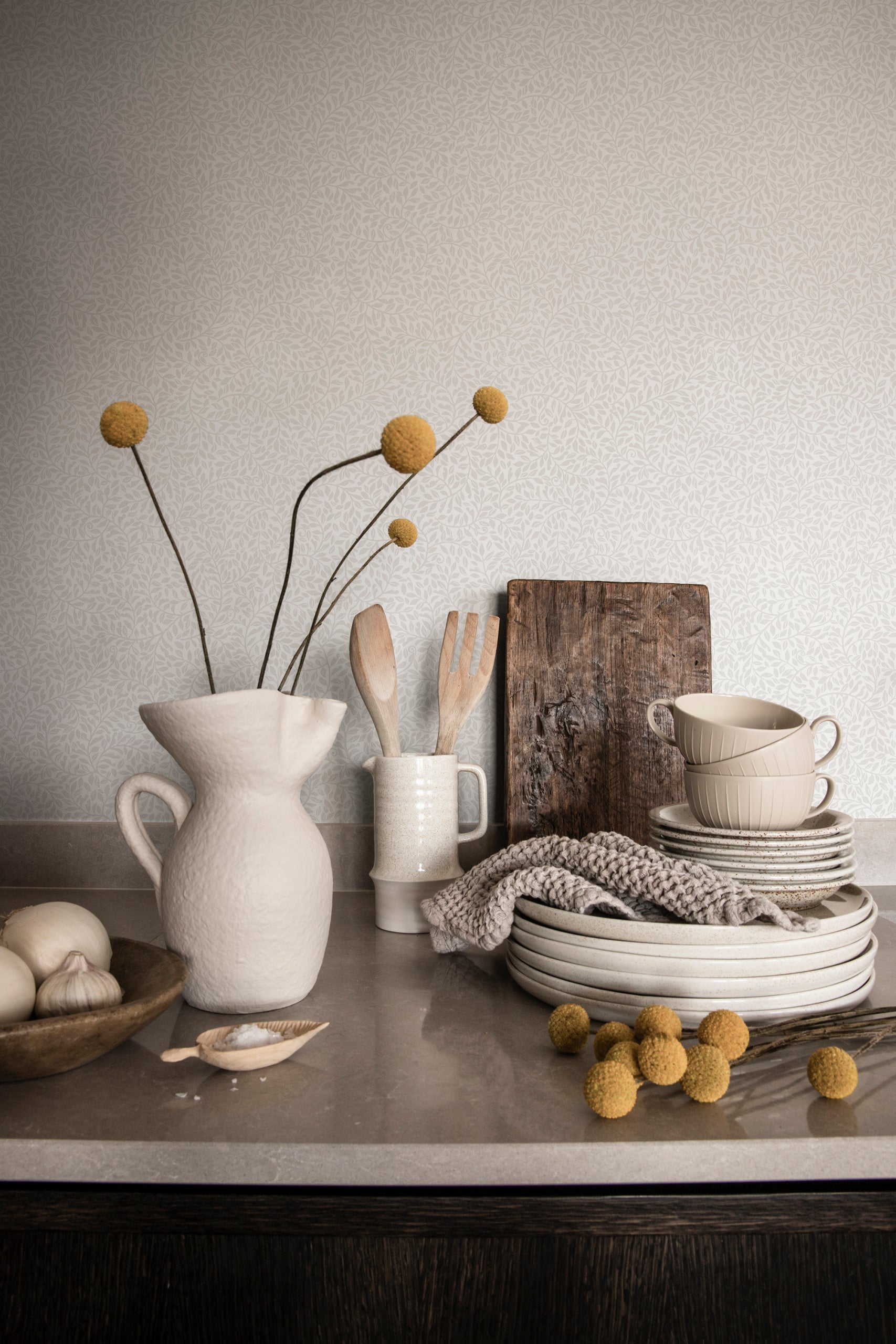 Bladverk wallpaper by Sandberg in Grey, styled on an interior wall