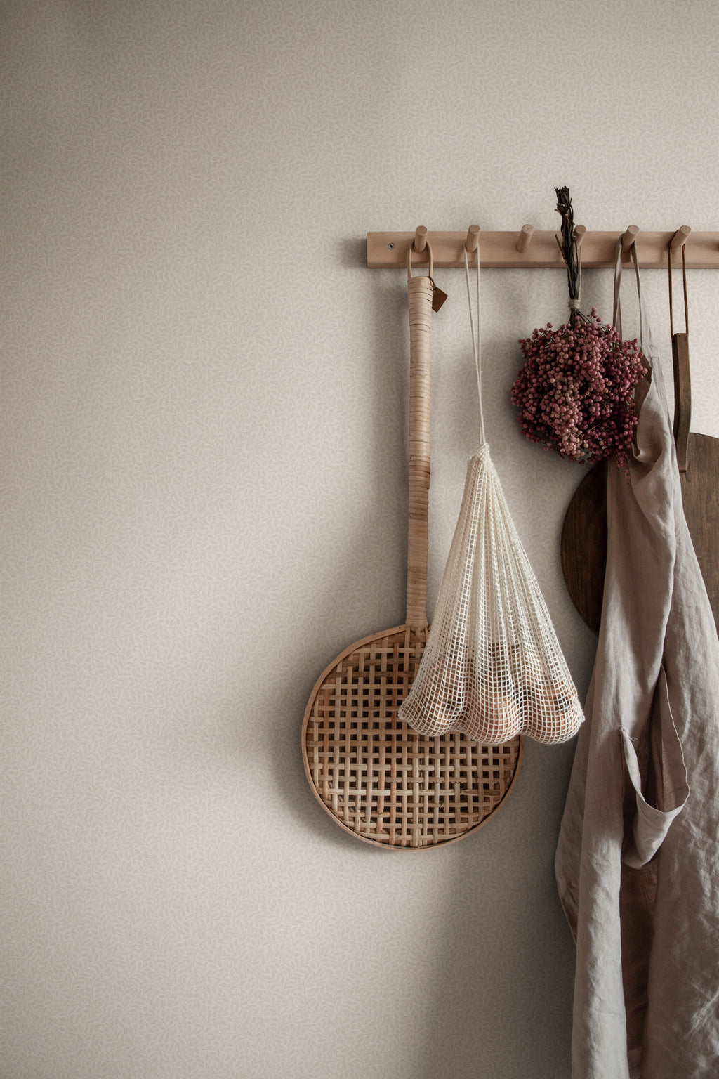 Bladverk wallpaper by Sandberg in Sandstone, styled on an interior wall