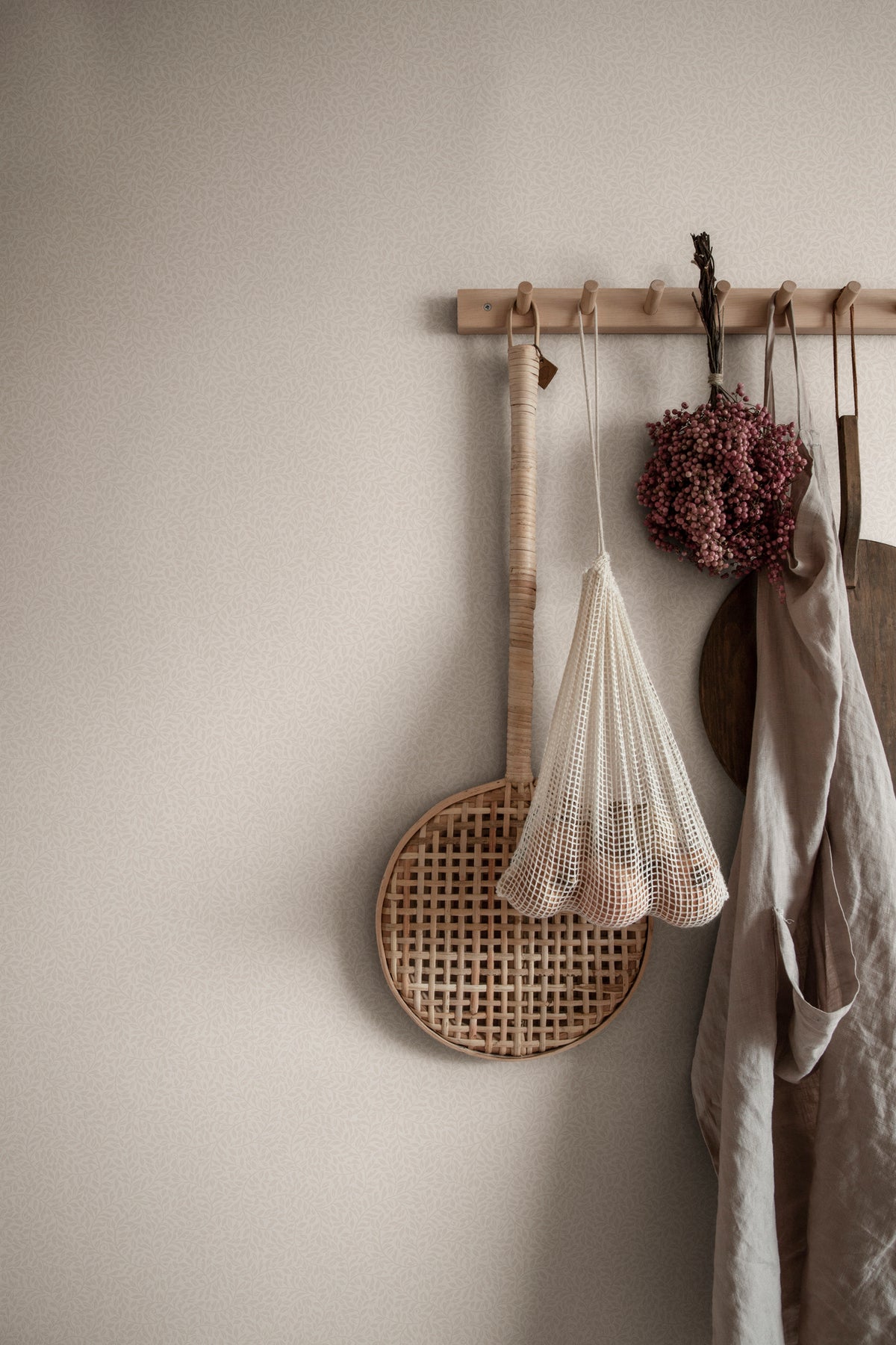 Bladverk wallpaper by Sandberg in Sandstone, styled on an interior wall