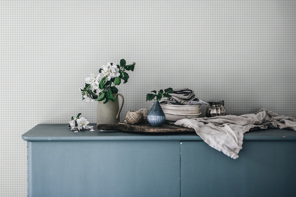 Ruta wallpaper by Sandberg in Misty Blue, styled on an interior wall