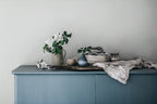 Ruta wallpaper by Sandberg in Misty Blue, styled on an interior wall