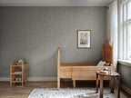Blue-grey Marion marbled wallpaper by Sandberg in a bedroom with pine bed, rattan shelf and framed print
