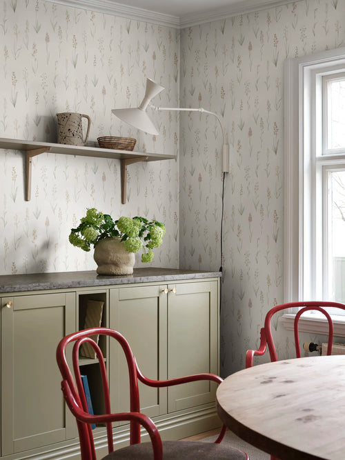 Alma wallpaper by Sandberg, botanical wildflower print in a dining area with a marble shelf and hydrangeas