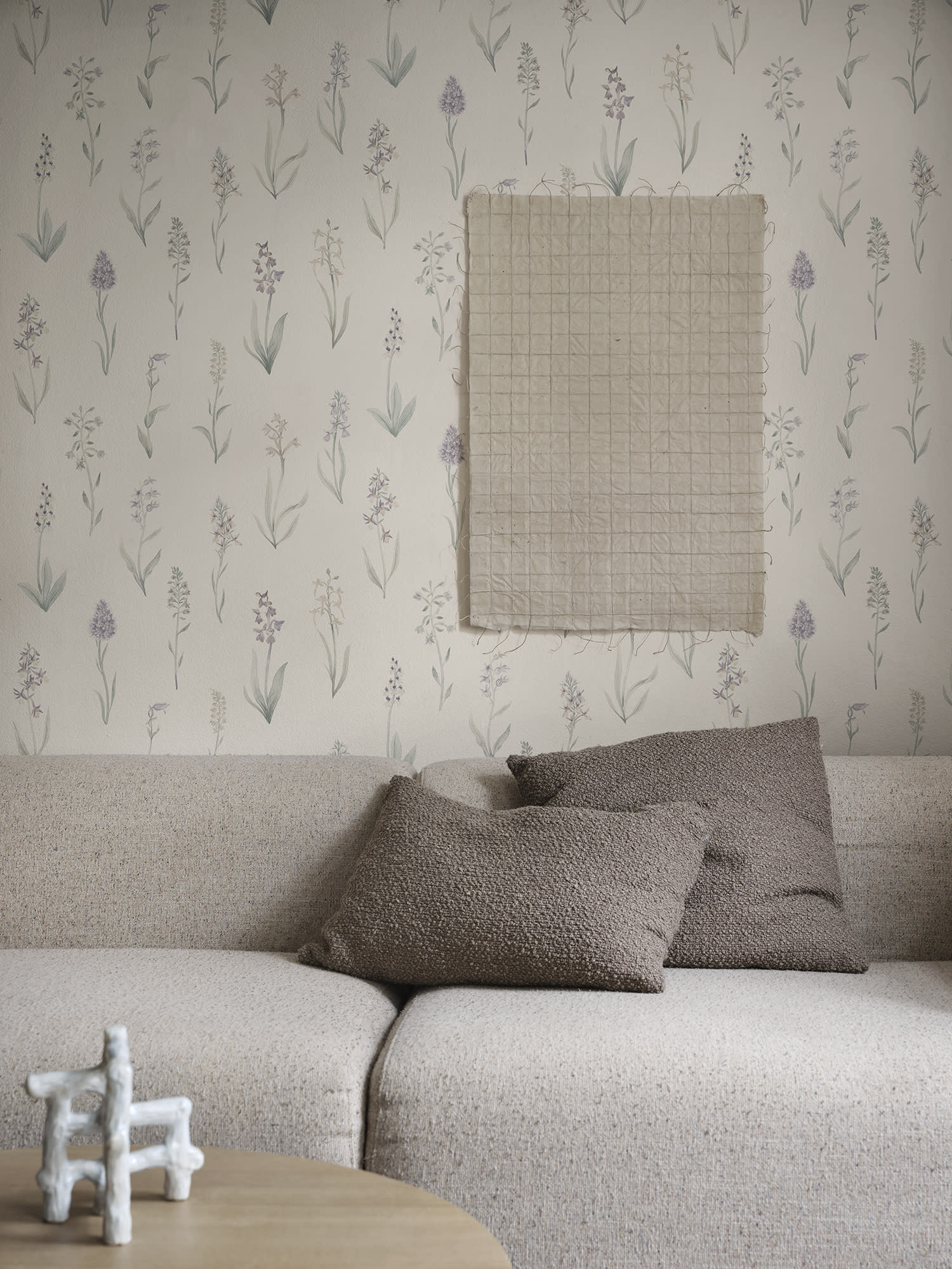 Alma wallpaper by Sandberg in Lilac, styled on an interior wall