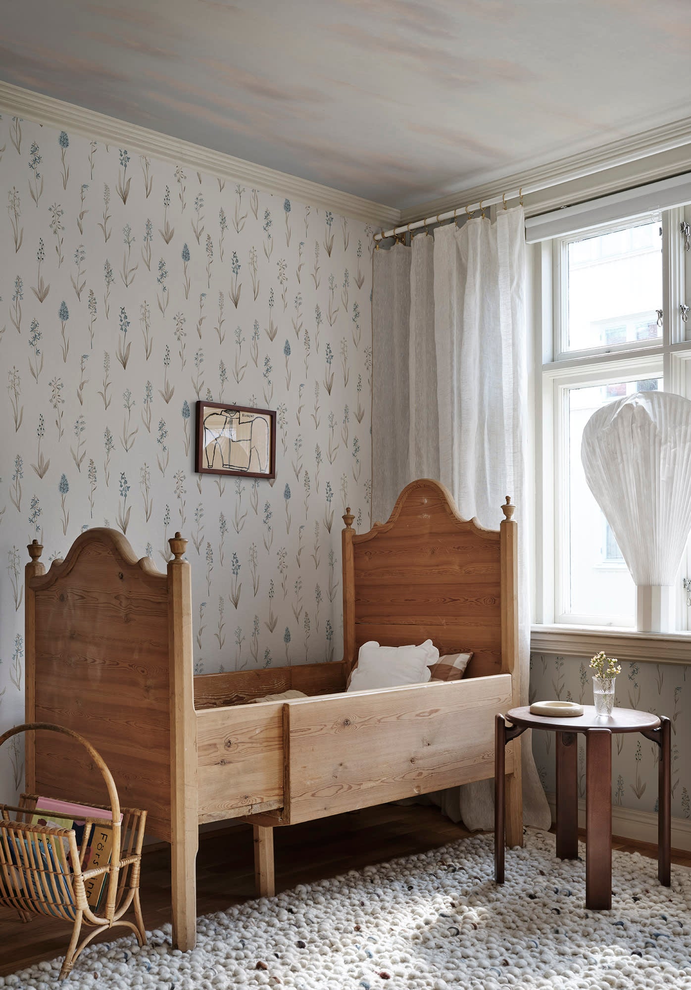 Alma wallpaper by Sandberg in Misty Blue, styled on an interior wall