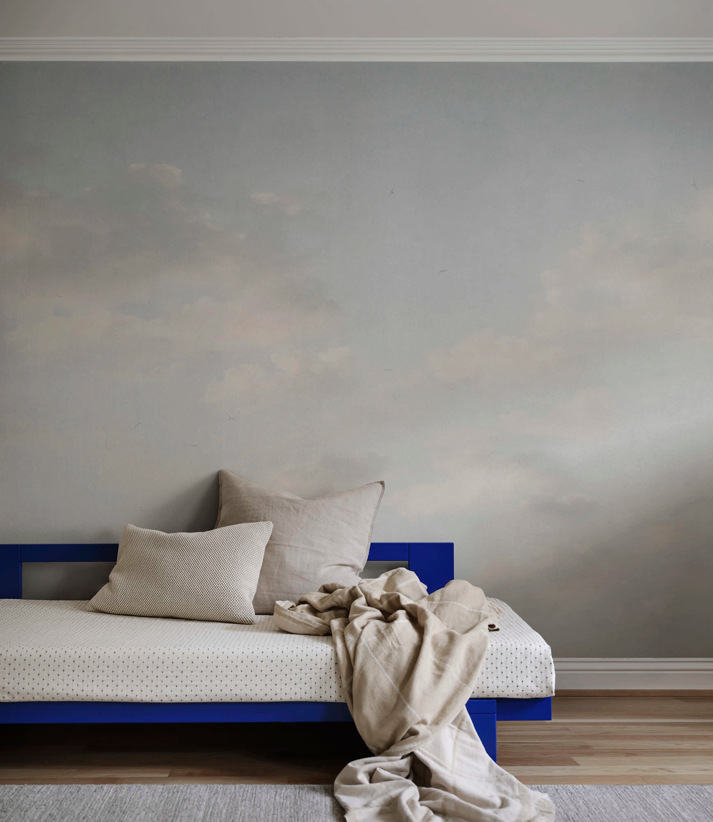 Moln wall mural by Sandberg – sky & clouds design, Light Blue – styled in a room setting, view 2